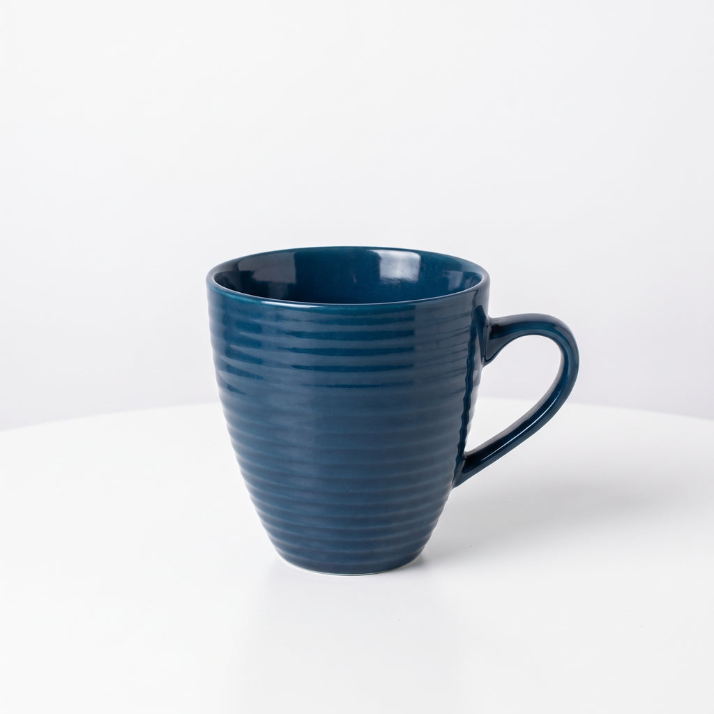 Elegant dark blue ceramic coffee cup with a wavy pattern